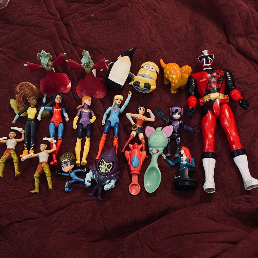 Source Unknown Action Figure Collection with Red and Black Hero